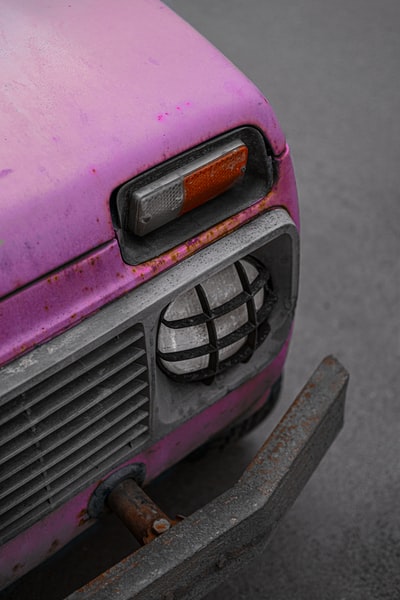 The pink and black car close-up photography
